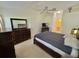 This main bedroom has carpet, ceiling fan, and an en suite bathroom at 18142 Baywood Forest Dr, Hudson, FL 34667