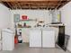Basement with laundry machines, water filtration system, and circuit breaker at 10029 Freestone Ln, Port Richey, FL 34668