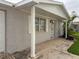 Charming single-story home featuring brickwork, well-maintained landscaping, and a welcoming covered entryway at 10029 Freestone Ln, Port Richey, FL 34668