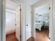Hallway leading to bathroom and bedroom with tiled floor at 10029 Freestone Ln, Port Richey, FL 34668