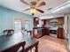 Kitchen dining area with stainless steel appliances, granite countertops, and a ceiling fan at 10029 Freestone Ln, Port Richey, FL 34668