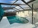 Inviting screened-in pool featuring a bright, well-maintained deck and a secure, modern railing system at 10029 Freestone Ln, Port Richey, FL 34668
