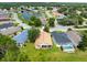A charming neighborhood with houses surrounded by green landscape and a beautiful pond at 10097 Holly Berry Dr, Weeki Wachee, FL 34613
