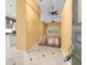 Bright foyer with views into the living area, kitchen, and hardwood floors at 10097 Holly Berry Dr, Weeki Wachee, FL 34613