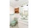 Well lit bathroom with a tiled backsplash and a light green sink at 10123 Oak Hill Dr, Port Richey, FL 34668