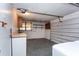 Garage with storage, lighting, and space for laundry and parking at 10123 Oak Hill Dr, Port Richey, FL 34668