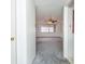 Open living room area with a ceiling fan and natural light at 10123 Oak Hill Dr, Port Richey, FL 34668