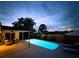 Enjoy the evening in your private rectangular pool and covered patio with comfortable outdoor furniture at 10224 Old Orchard Ln, Port Richey, FL 34668
