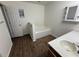 Bathroom featuring a bathtub, sink, vanity, and window, with hardwood floors throughout at 11308 Mahopac Rd, Weeki Wachee, FL 34614