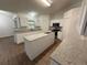 Well-equipped kitchen with granite countertops, white cabinetry, and stainless steel appliances at 11308 Mahopac Rd, Weeki Wachee, FL 34614
