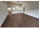 Spacious living room boasts laminate flooring and features decorative wall niches at 11308 Mahopac Rd, Weeki Wachee, FL 34614