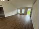 Bright living room with laminate flooring and lots of natural light at 11308 Mahopac Rd, Weeki Wachee, FL 34614