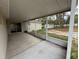 Covered patio provides a comfortable outdoor living space overlooking the backyard at 11308 Mahopac Rd, Weeki Wachee, FL 34614