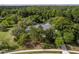 Beautiful aerial view of a home surrounded by lush trees and landscaping at 11510 Lakeview Dr, New Port Richey, FL 34654