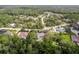 Aerial view of property showcasing neighborhood, surrounding landscape, and pool at 11510 Lakeview Dr, New Port Richey, FL 34654