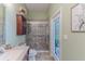 Modern bathroom with a glass shower, and a door to the outside area at 11510 Lakeview Dr, New Port Richey, FL 34654
