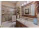Classic bathroom featuring a shower/tub combo, vanity and tile flooring at 11510 Lakeview Dr, New Port Richey, FL 34654