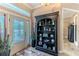 Welcoming foyer with decorative shelving and glass paneled front door at 11510 Lakeview Dr, New Port Richey, FL 34654