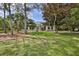 Charming single story home with a manicured lawn and mature trees at 11510 Lakeview Dr, New Port Richey, FL 34654
