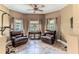 Inviting living room features two leather recliners and large windows for natural light at 11510 Lakeview Dr, New Port Richey, FL 34654