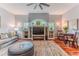 Bright living room features built-in shelving, a large television, and hardwood floors at 11510 Lakeview Dr, New Port Richey, FL 34654