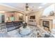 Comfortable living room featuring a stone fireplace and neutral color palette at 11510 Lakeview Dr, New Port Richey, FL 34654