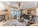 Inviting living room with fireplace and view to the outdoor area at 11510 Lakeview Dr, New Port Richey, FL 34654