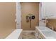 Mud room with storage, bench, and sink, perfect for organization and convenience at 11510 Lakeview Dr, New Port Richey, FL 34654