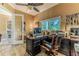 Comfortable home office with built-in desk and natural lighting at 11510 Lakeview Dr, New Port Richey, FL 34654
