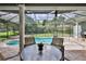 Inviting screened-in pool area with outdoor seating and lush green surroundings for relaxing at 11510 Lakeview Dr, New Port Richey, FL 34654