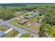 An aerial view displays the location of the home with fenced backyard and the tranquil residential surroundings at 12026 Penguin Ave, Weeki Wachee, FL 34614
