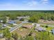 An elevated view showcases this home within a community, boasting a fenced yard and tranquil residential surroundings at 12026 Penguin Ave, Weeki Wachee, FL 34614