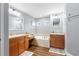 Bright main bathroom featuring double sinks, a makeup vanity, and a garden tub at 12026 Penguin Ave, Weeki Wachee, FL 34614