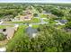 Expansive aerial view of a residential neighborhood with well-maintained lawns and mature trees at 12060 Sapphire Dr, Spring Hill, FL 34609