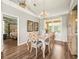 Bright dining room with wood floors, chandelier, and large window is perfect for Gathering meals at 12060 Sapphire Dr, Spring Hill, FL 34609