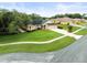 Beautiful single-story home featuring a spacious lawn, tidy landscaping and long driveway at 12060 Sapphire Dr, Spring Hill, FL 34609