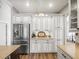 Modern kitchen features sleek cabinetry, stainless steel appliances, and contrasting island creating a stylish design at 12060 Sapphire Dr, Spring Hill, FL 34609