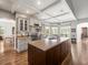 Open concept kitchen with an island, granite countertops, stainless appliances, and coffered ceilings at 12060 Sapphire Dr, Spring Hill, FL 34609