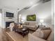 Cozy living room with a fireplace and comfortable seating at 12060 Sapphire Dr, Spring Hill, FL 34609