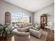 Comfortable living room with hardwood floors, a large window, and decorative details at 12060 Sapphire Dr, Spring Hill, FL 34609