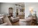 Cozy living room with comfortable seating and a decorative display cabinet showcases a warm and inviting atmosphere at 12060 Sapphire Dr, Spring Hill, FL 34609