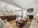 Open-concept living space featuring a kitchen, dining area, fireplace and living room at 12060 Sapphire Dr, Spring Hill, FL 34609