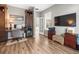Office space with custom built-ins, desk, and mini-fridge, perfect for a functional workspace at 12060 Sapphire Dr, Spring Hill, FL 34609