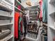 Organized walk-in closet featuring built-in shelving and storage for shoes, clothing, and accessories at 12060 Sapphire Dr, Spring Hill, FL 34609