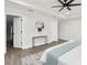 Corner view of bedroom with adjoining bathroom and walk in closet at 12420 Talpa St, Spring Hill, FL 34608