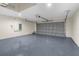 Spacious garage features a light gray epoxy floor and an automatic garage door at 12420 Talpa St, Spring Hill, FL 34608