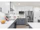 Well-appointed kitchen with stainless steel appliances, quartz countertops, modern cabinetry and stylish subway tile backsplash at 12420 Talpa St, Spring Hill, FL 34608