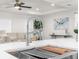 Close-up of a modern kitchen sink with a pull-down faucet and a view into a beautifully decorated living area at 12420 Talpa St, Spring Hill, FL 34608