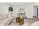 Bright living room with modern furniture, neutral decor and lots of natural light at 12420 Talpa St, Spring Hill, FL 34608