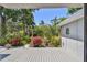 Relaxing deck featuring a view of a lush garden with a charming fountain at 1265 Royal Oak Dr, Dunedin, FL 34698